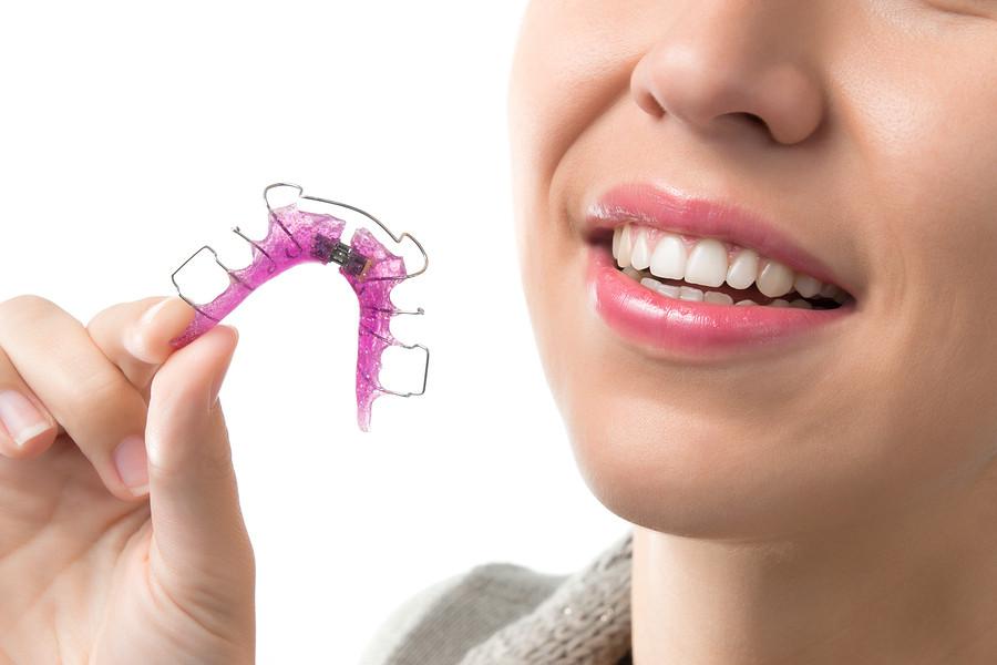 What-Exactly-Can-An-Orthodontist-Do-For-My-Teeth-woman-with-removable-appliance
