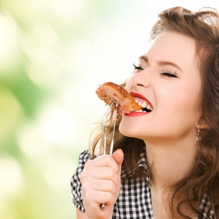 7 Amazing Truths About Dental Implants biting steak